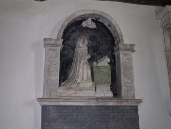 Kneeling at a prayer desk