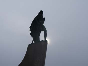 Statue facing cathedral